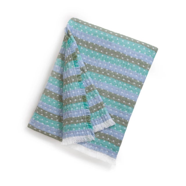 Available for a limited time only, this throw blanket in collaboration with interior designer Sara Gilbane, is the perfect...