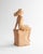 A beautifully expressive sculpture in painted plaster, depicting a seated female figure, signed and dated 1944 by sculptor...
