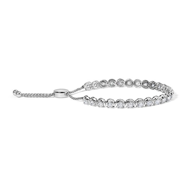 Indulge in the epitome of sophistication with our Diamond Adjustable Bolo Tennis Bracelet. Crafted from radiant 14K white...