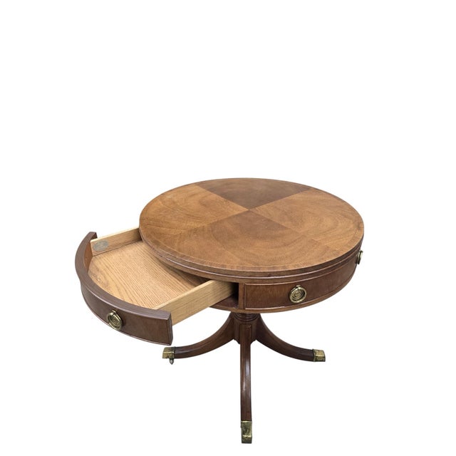Vintage Baker Furniture Mahogany Drum Table with Four Drawers and Brass Hardware An elegant Baker Furniture drum table...