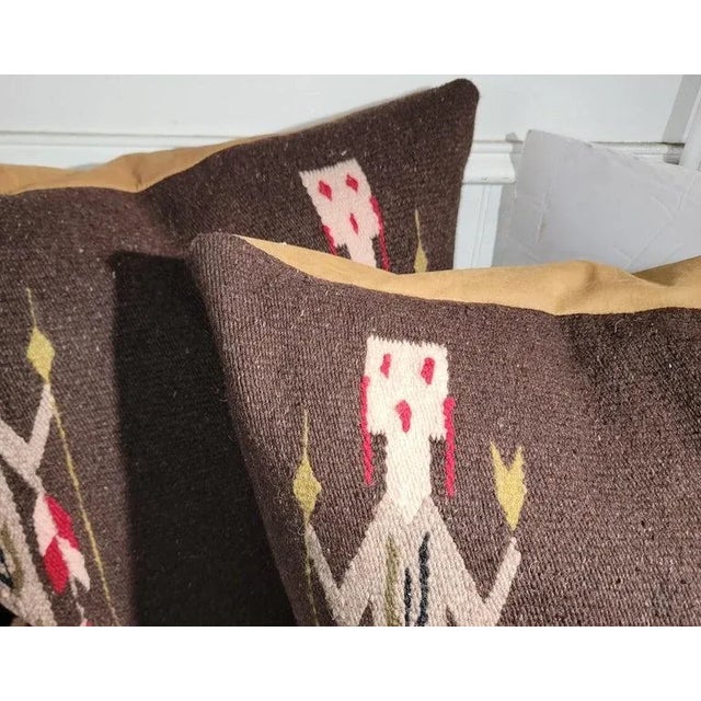 Yei woven pillows with amazing soft leather / suede backings.The inserts are down & feather fill.Sold as a pair. The yei...
