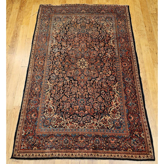 "Vintage Persian Kashan Area Rug, meticulously hand-knotted in the early 1900s. This beautiful rug features an intricate...