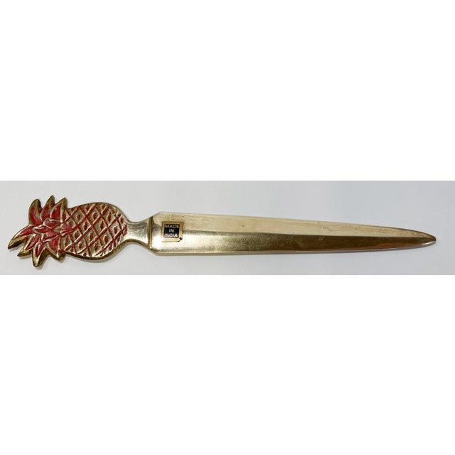 Make it twice as exciting to open snail mail with this classic vintage brass pineapple letter opener. Red enamel detail to...