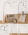 A striking vintage floor lamp by Nova of California featuring four sweeping brass arc arms terminating in globe bulbs. The...