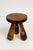 A custom Claude Home Louie stool. Dark wood tripod base with a round seat. New, unused. This model is discontinued. 12"...