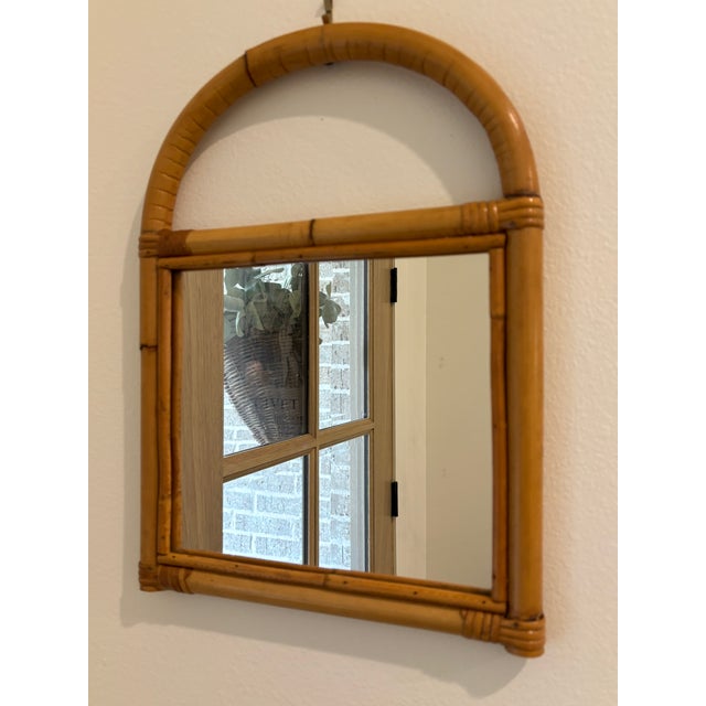 Vintage petite arched rattan and bamboo wall mirror that would be a perfect addition to a gallery wall, accent on a plate...
