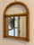 Vintage petite arched rattan and bamboo wall mirror that would be a perfect addition to a gallery wall, accent on a plate...