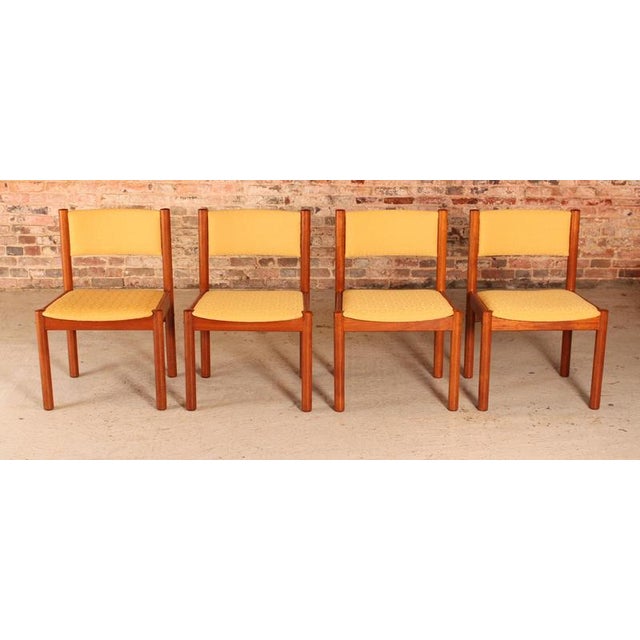 Set of 4 Danish Mid Century teak dining chairs with yellow fabric upholstery, circa 1970s. Excellent condition with no...