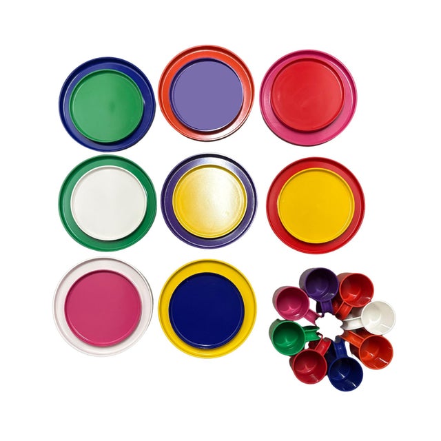 Iconic rainbow stacking plates and Max Mugs designed by Massimo Vignelli for Heller, featuring a clever nesting design...