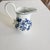 Here is a small cream/milk pitcher by Carl Teichert. The pattern is Blue Onion and features a white background with floral...