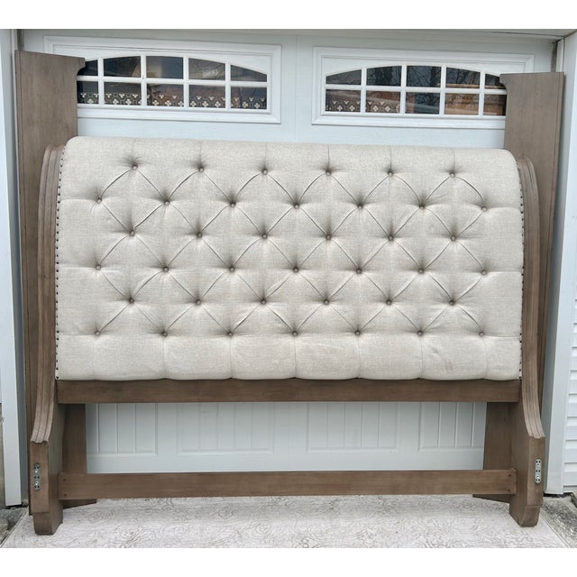 Pre-owned Early 2000's King Bed has a Transitional Style . The Bed has a Wood Frame. Fabric High Back Headboard / Low...