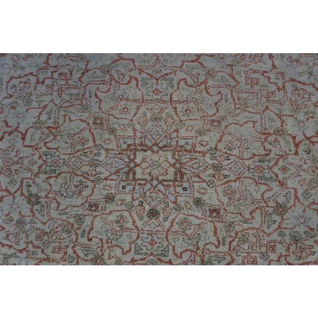 An elegant room-sized Antique Persian Tabriz carpet, circa 1920. Measuring 7' x 9' 7", this piece is distinguished by its...
