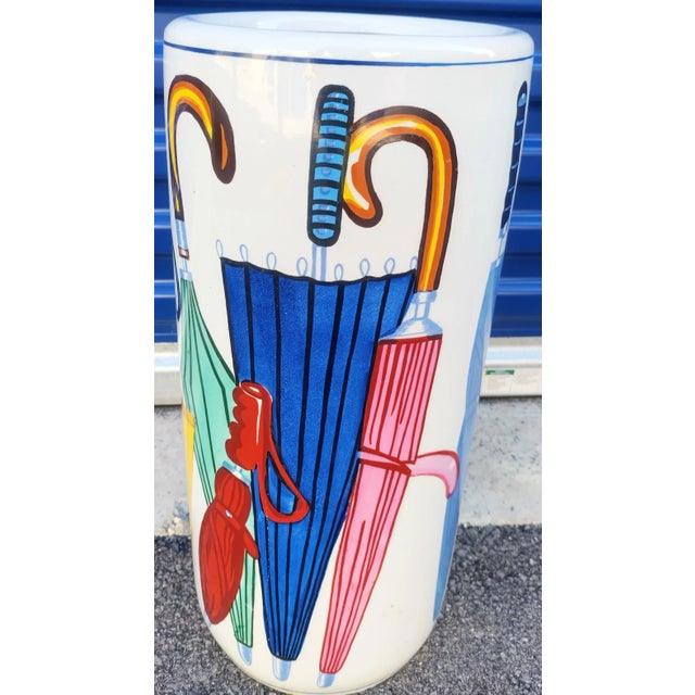 A pretty whimsical ceramic vintage umbrella holder. This is such a pretty holder with colorful umbrellas all around.