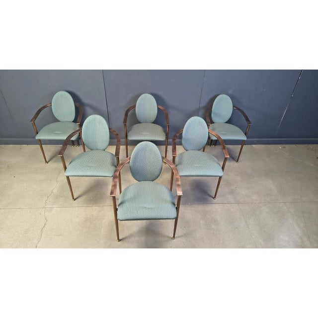 Set of six elegant dining room chairs manufactured by Belgochrom. Nicely designed copper coloured metal frames with...