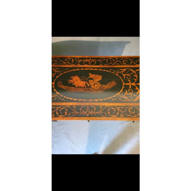 This is a 19th century French Empire style writing desk. This features intricate marquetry inlay of floral and figural...