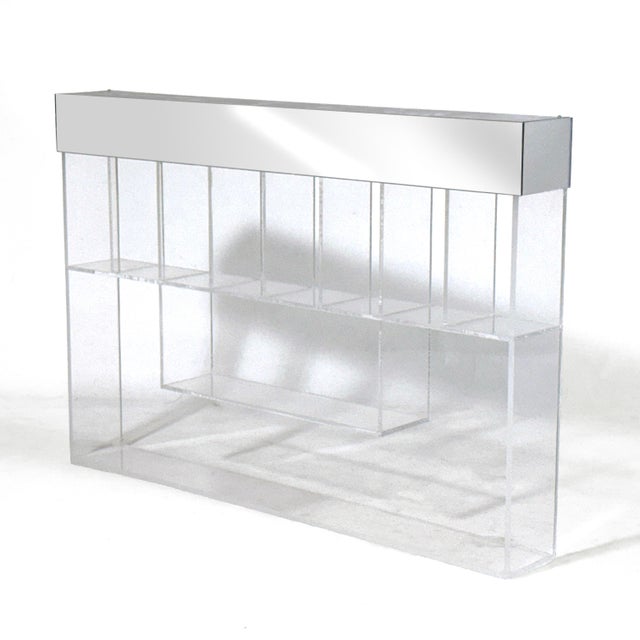This custom-made 1970s lucite display shelf mounts on the wall with a French cleat. It has 10 compartments for displaying...
