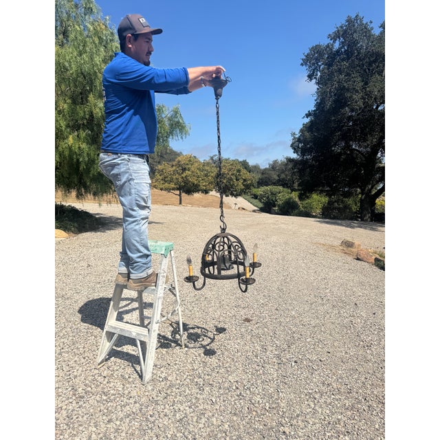 From historic Spanish Santa Barbara ranch Chandelier modified with center downlight added, making it perfect over a game...