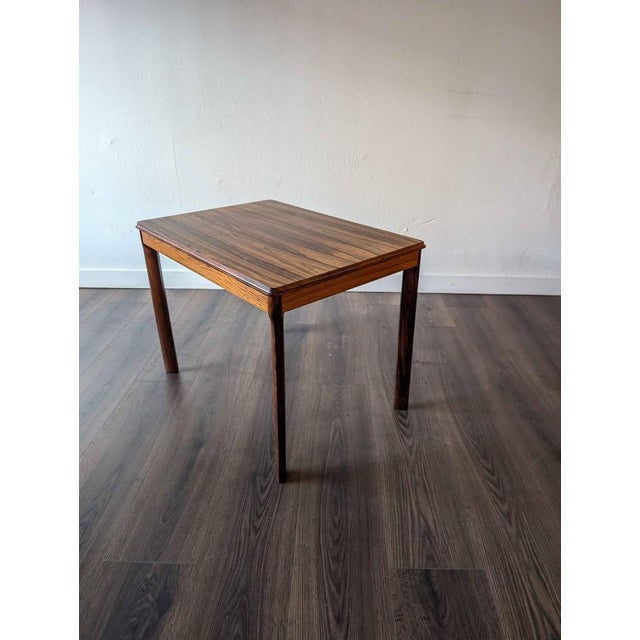 Beautiful little mid century modern Scandinavian Rosewood end table. Height 27.5" Width 27.5" Depth 19.75"