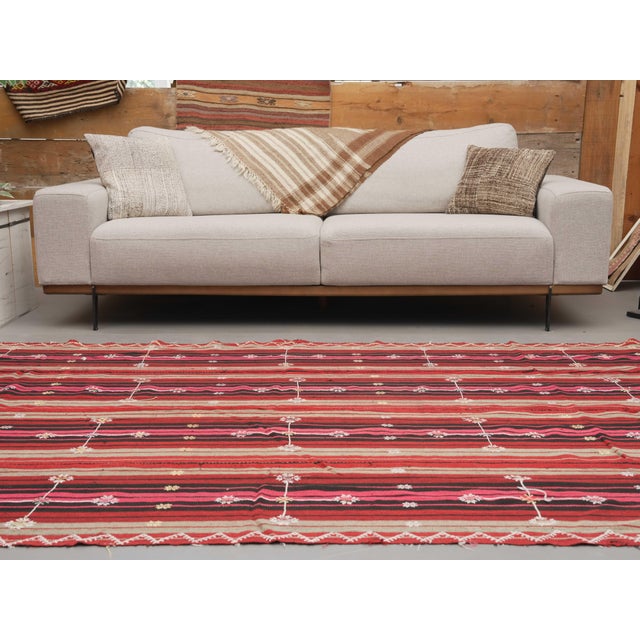 Vintage Hand-Knotted runner rug is a semi-antique vintage area rug. The '70s Eastern region of Anatolia's unique rug is...