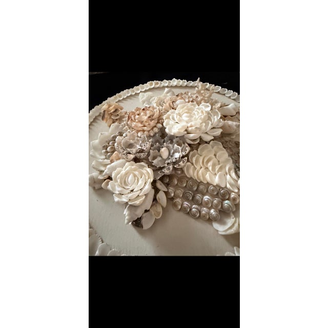 Sculptural shelled wall plaque in a monochromatic palette. Original and unique.