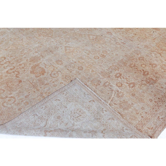 A late 19th century Indian Amritsar antique rug, the cream field with a very an overall enlarged cloudband, palmette and...