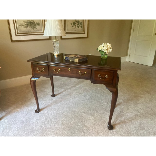 Elegant Henkel Harris solid mahogany writing desk in classic Queen Anne style featuring beautiful cabriole legs,...