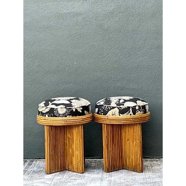 This pair of vintage Schumacher stools sets a plush, bold-patterned seat above a sculptural base of pencil reed. Each...