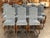 Design Plus Gallery presents a Set of Twelve Dining Chairs. Each chair has a tall, upholstered back and seat in a blue...