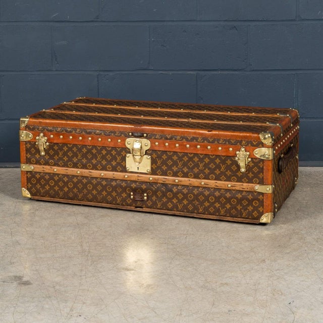 A fine louis vuitton steamer trunk dating to the 1930s, executed in the iconic monogram canvas with natural leather trim,...