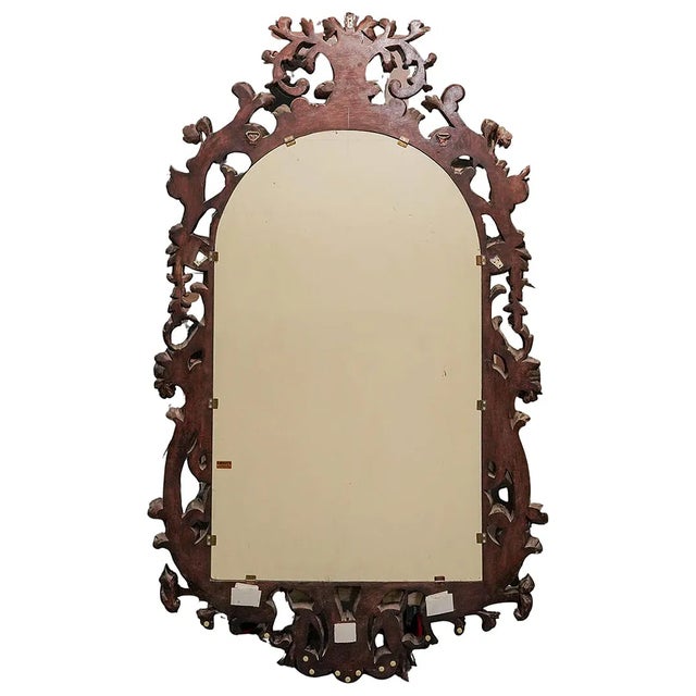 This antique French Rococo style wood wall mirror is a stunning piece that stands at 67 inches tall. The heavily carved...