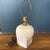 Vintage off-white ceramic table lamp. The base has a unique post modern shape. The bottom is square, and the top is...