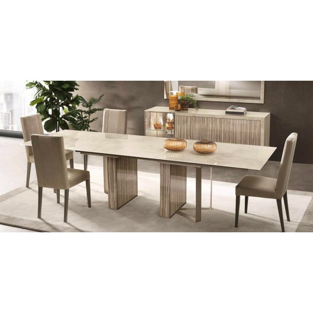 Elevate your dining space with the Casa Milano Luce Collection, a luxurious 10-piece Italian dining room set designed with...