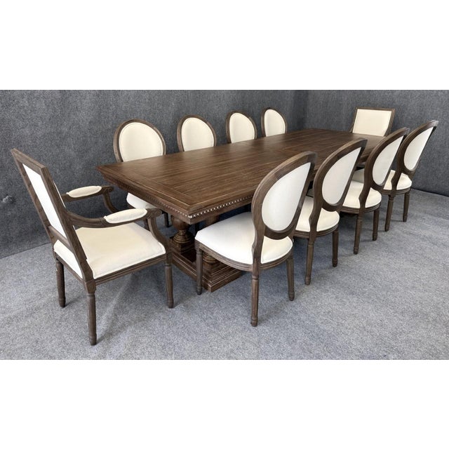 This 11-piece Restoration Hardware dining set is anchored by the grand St. James rectangular extension table, expanding...