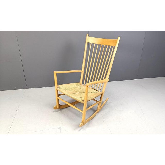 Mid century beech wooden and papercord rocking chair designed by Hans J Wegner for FDB Mobler in the 1960s. Beautifully...
