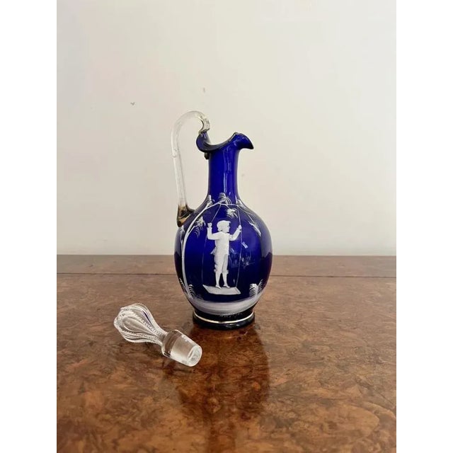 Stunning quality antique Mary Gregory blue glass decanter having a stunning quality Mary Gregory blue glass decanter with...