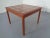 Square teak coffee table from the 1960s. Ceramic top.
