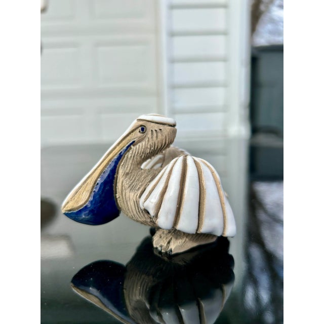 Authentic Artesania Rinconada pelican made in Uruguay. The texture and glaze colors are everything you’d want in a...