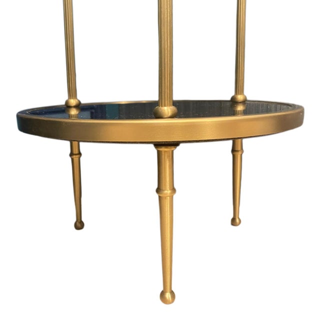 Pair of petite two-tier side tables by Global Views, model Petite 2 Tiered, featuring a refined vertical silhouette...