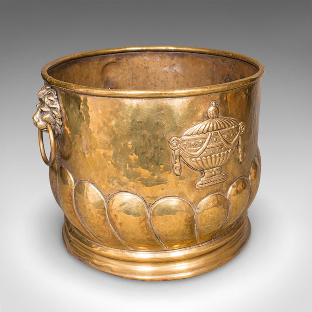 This is an antique coal bucket. A French, polished brass fireside fuel basket in Art Nouveau taste, dating to the late...