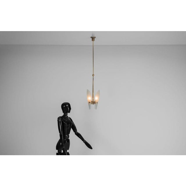 This exquisite pendant lamp, model 1636, designed by the legendary Max Ingrand for Fontana Arte in 1960, is a rare and...