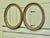A pair of Simulated Wood Finish Oval Mirrors These Mirrors have very attractive wide moulded oval frames, these have a...