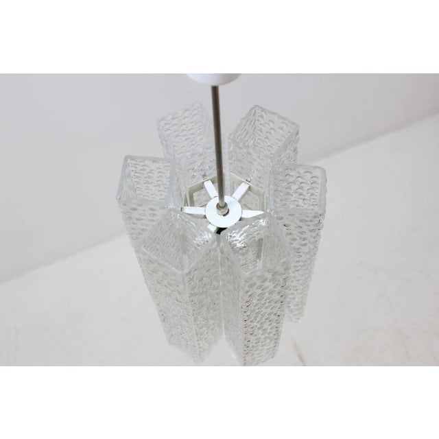This glass and metal lamp features shades with a diameter of 40 x 7,5 cm. European Plug (up to 250V).The wiring of this...