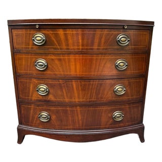 Late 20th Century Georgian-Style Bowfront Flame Mahogany Chest of Drawers by Baker Furniture. For Sale
