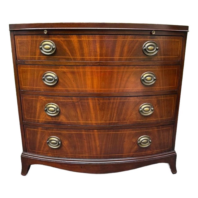 Late 20th Century Georgian-Style Bowfront Flame Mahogany Chest of Drawers by Baker Furniture. For Sale