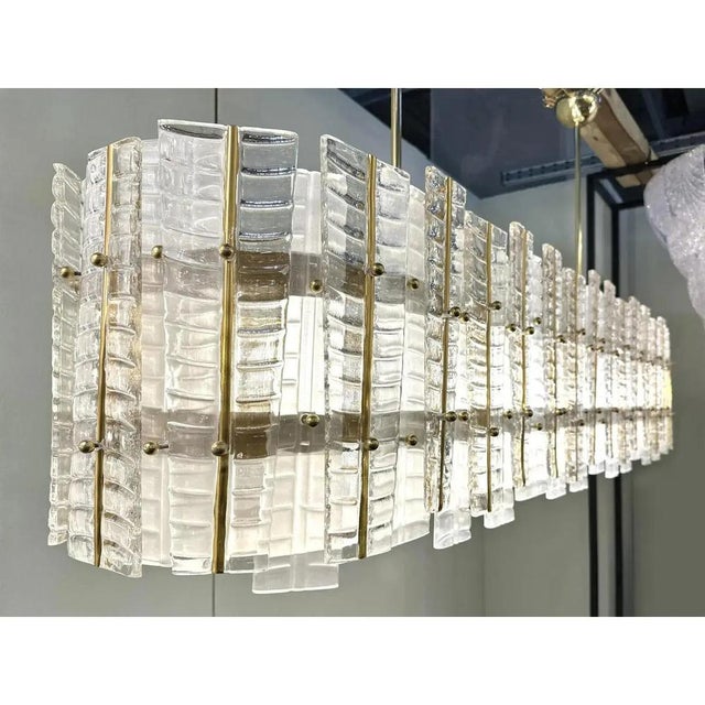 Contemporary gold chandelier in murano glass full of leafes that give a touch of "tropical" design. extremally elegant and...