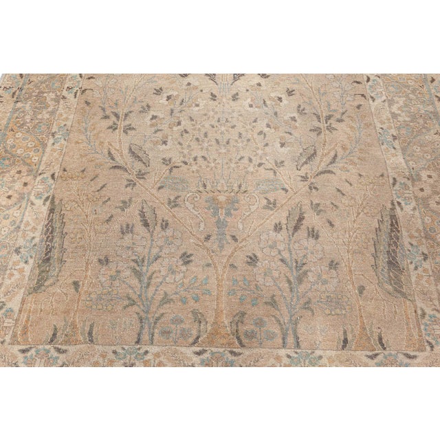 This medium-sized antique rug encompasses the essence of the enormous Tabriz carpet heritage. It was made in the renowned...