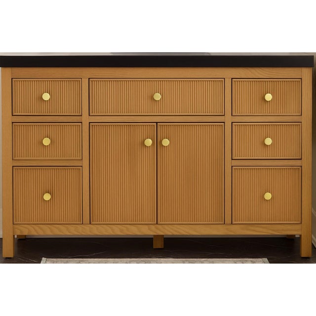 A stunning mid century Brasilia style single sink bathroom vanity. Features two hinged doors with sculptural hand carved...