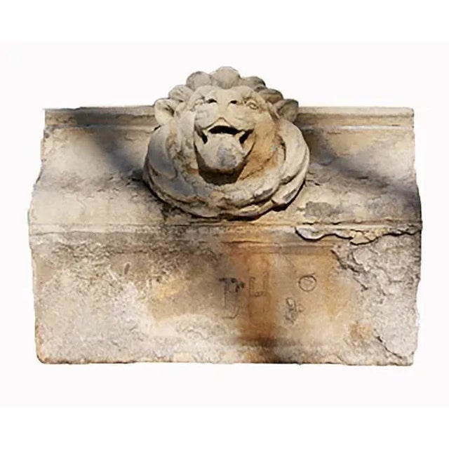 Antique early 20th century decorative terra cotta "brick". Sculpted face with central lion head motif in relief.