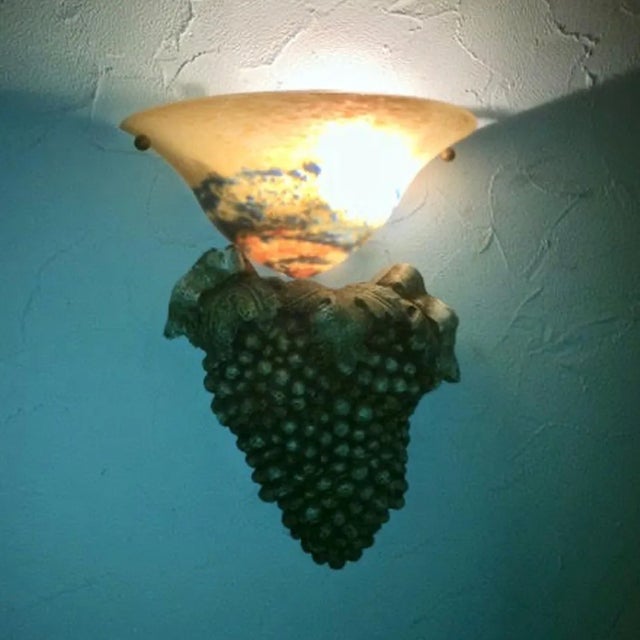 Made in France 1995. Three matched, handmade unique wall lamps. The shades are of pate de verre glass with mostly blue and...