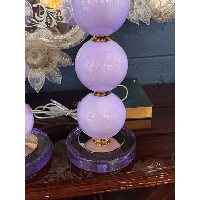 The pair of lavender Murano glass lamps exudes elegance and charm with their stunning glass material. Each lamp is crafted...